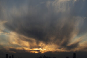 a big cloud that's covering the sky. it is yellow and has some purple