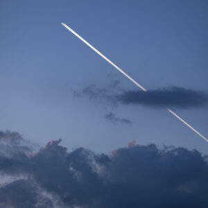 a plane flying through a cloud.