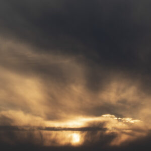 a big cloud that's covering the sky. it is yellow and has some purple