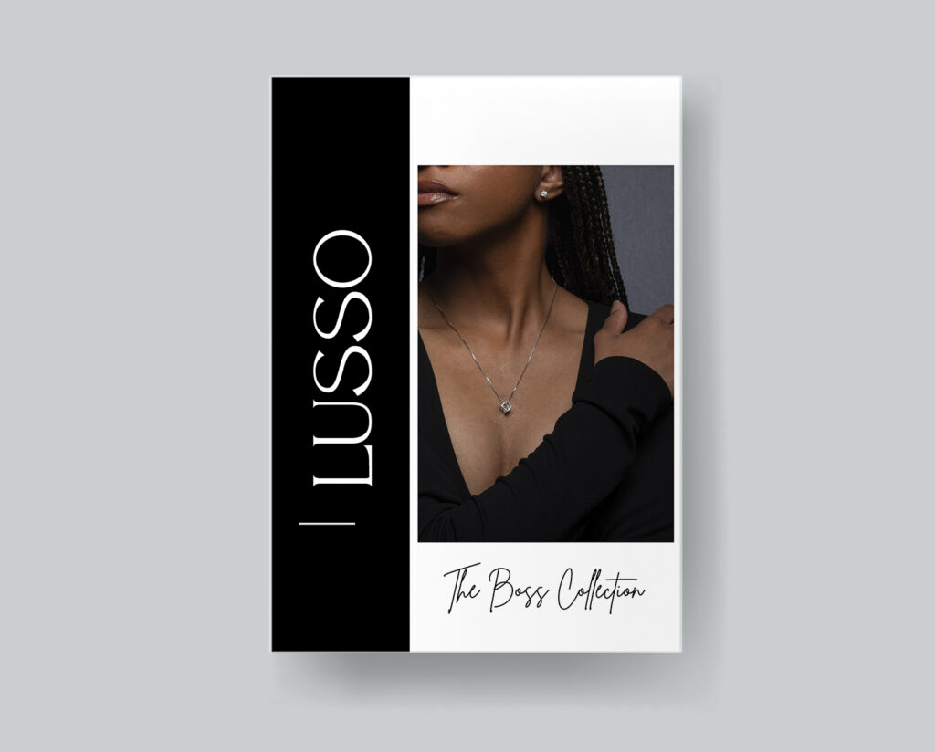 A magazine cover. the cover has a young woman on it that's wearing a necklace and earrings.